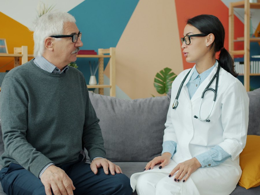 Senior man talking with a doctor at home
